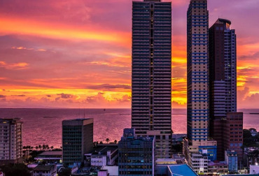 An evening cityscape photo of apartment blocks in Manilla